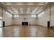 Spacious indoor basketball court with hardwood flooring at 15967 Clear Skies Pl, Lakewood Ranch, FL 34211