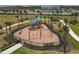 Community playground with swings, slides, and climbing structures for children at 15967 Clear Skies Pl, Lakewood Ranch, FL 34211