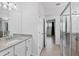 Main bathroom with granite vanity, large mirror and walk-in shower at 15967 Clear Skies Pl, Lakewood Ranch, FL 34211