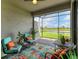 Relaxing screened patio overlooking a pond at 15967 Clear Skies Pl, Lakewood Ranch, FL 34211