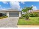 Single-Gathering home with a two-car garage and attractive landscaping at 15967 Clear Skies Pl, Lakewood Ranch, FL 34211