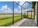 Spacious screened-in patio with a view of the lake at 15967 Clear Skies Pl, Lakewood Ranch, FL 34211