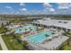 Large swimming pool with plenty of lounge chairs at 15967 Clear Skies Pl, Lakewood Ranch, FL 34211