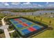 Aerial view of four well-maintained pickleball courts in a residential community at 15967 Clear Skies Pl, Lakewood Ranch, FL 34211
