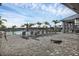 Resort-style pool with lounge chairs and a palm tree backdrop at 15967 Clear Skies Pl, Lakewood Ranch, FL 34211