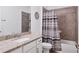 Clean bathroom with granite countertop, bathtub, and shower at 15967 Clear Skies Pl, Lakewood Ranch, FL 34211