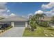 Two-story luxury home with a three-car garage and a nicely landscaped yard at 15967 Clear Skies Pl, Lakewood Ranch, FL 34211