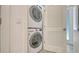 Compact laundry room featuring a stacked LG washer and dryer at 1778 10Th St, Sarasota, FL 34236