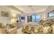 Main bedroom with ocean view and king-size bed at 19 Whispering Sands Dr # 201, Sarasota, FL 34242