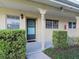 Condo building exterior with teal front door at 2465 Northside Dr # 906, Clearwater, FL 33761