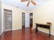 Bright bedroom with wood floors, built-in desk, and access to bathroom at 2465 Northside Dr # 906, Clearwater, FL 33761