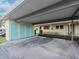 Covered parking area with storage units at 2465 Northside Dr # 906, Clearwater, FL 33761