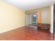 Living room with wood-look floors and sliding doors to a patio at 2465 Northside Dr # 906, Clearwater, FL 33761