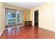 Living room has wood-look floors and sliding doors to a patio at 2465 Northside Dr # 906, Clearwater, FL 33761