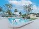 Inviting community pool with surrounding lounge chairs and patio at 2465 Northside Dr # 906, Clearwater, FL 33761
