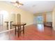 Dining room features wood-look floors, a round table, and mirrors at 2465 Northside Dr # 906, Clearwater, FL 33761