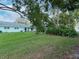 Spacious backyard with green grass and landscaping at 2465 Northside Dr # 906, Clearwater, FL 33761