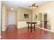 Dining room with wood-look floors, a round table, and mirrors at 2465 Northside Dr # 906, Clearwater, FL 33761