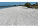 Wide sandy beach with footprints, showcasing the coastal lifestyle and space for recreation at 3710 Gulf Of Mexico Dr # F1, Longboat Key, FL 34228
