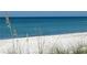 Stunning view of a tranquil beach with white sand and clear water at 3710 Gulf Of Mexico Dr # F1, Longboat Key, FL 34228
