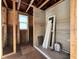 Unfinished bathroom with shower pan and window, ready for tiling and fixtures at 5700 N Lockwood Ridge Rd, Sarasota, FL 34243