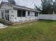 Small house under construction, white exterior at 5700 N Lockwood Ridge Rd, Sarasota, FL 34243