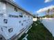 Unfinished exterior of new construction home, wrapped in house wrap at 5700 N Lockwood Ridge Rd, Sarasota, FL 34243