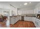 View of the kitchen featuring stainless appliances, light countertops and an open floor plan at 7011 Woodmore Ter, Lakewood Ranch, FL 34202