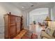 Bright and open living area with wood floors, shutters, and comfortable furnishings at 7011 Woodmore Ter, Lakewood Ranch, FL 34202