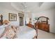Main bedroom with ensuite bathroom and decorative ceilings at 7011 Woodmore Ter, Lakewood Ranch, FL 34202