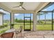 Screened porch with brick patio, wicker furniture, and a view of the backyard at 7767 Summerland Cv, Lakewood Ranch, FL 34202