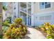 Well-maintained building entrance with landscaping and walkway at 7820 34Th W Ave # 102, Bradenton, FL 34209