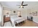 Bright bedroom with king-size bed, wood floors, and a ceiling fan at 7820 34Th W Ave # 102, Bradenton, FL 34209