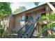 Exterior view of condo building showcasing stairs and landscaping at 1720 Glenhouse Dr # Gl428, Sarasota, FL 34231