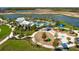Aerial view of community pool, playground, and clubhouse at 11655 Bluestone Ct, Parrish, FL 34219