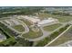 Aerial view of a modern elementary school with playground at 11655 Bluestone Ct, Parrish, FL 34219