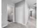 Bright hallway with access to bedrooms and laundry facilities at 11655 Bluestone Ct, Parrish, FL 34219