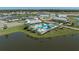 Aerial view of community pool, landscaping and lake at 11655 Bluestone Ct, Parrish, FL 34219