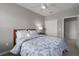 Spacious bedroom with a queen bed and en-suite bathroom access at 11655 Bluestone Ct, Parrish, FL 34219