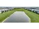 Townhouses with private screened porches situated around a lake at 11655 Bluestone Ct, Parrish, FL 34219