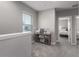 Lofted hallway with window, perfect for a home office at 11655 Bluestone Ct, Parrish, FL 34219