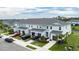 Two-story townhouses with attached garages and manicured landscaping at 11655 Bluestone Ct, Parrish, FL 34219