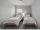 Cozy bedroom with two twin beds, perfect for children or guests at 11655 Bluestone Ct, Parrish, FL 34219