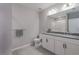 Modern bathroom with double vanity, granite countertop, and shower at 11655 Bluestone Ct, Parrish, FL 34219