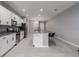Modern kitchen with white cabinets, granite countertops, and stainless steel appliances at 11655 Bluestone Ct, Parrish, FL 34219