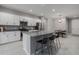 Modern kitchen with white cabinets, granite countertops, and stainless steel appliances at 11655 Bluestone Ct, Parrish, FL 34219