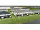 Community of townhouses with screened porches overlooking a lake at 11655 Bluestone Ct, Parrish, FL 34219