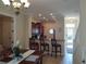 Kitchen and dining area with breakfast bar and access to living room at 11776 Angler'S Club Dr, Placida, FL 33946
