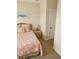 Bedroom with coastal bedding and private door access at 11776 Angler'S Club Dr, Placida, FL 33946