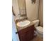 Bathroom with granite vanity and toilet at 11776 Angler'S Club Dr, Placida, FL 33946